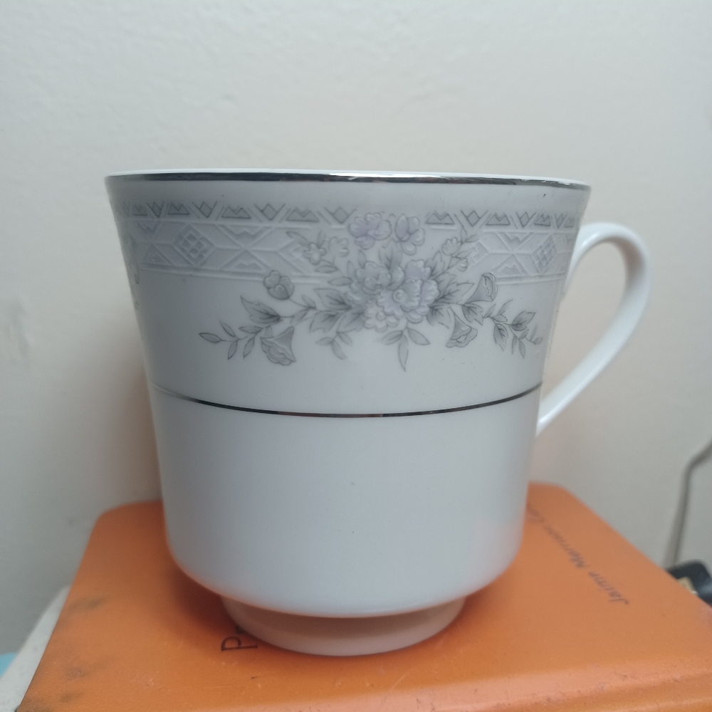 Sango set of silver embellished china